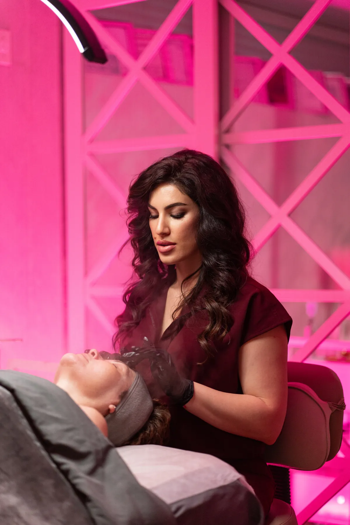 Licensed esthetician preparing a client's skin before a customized chemical peel at SI Glam Glow in Staten Island