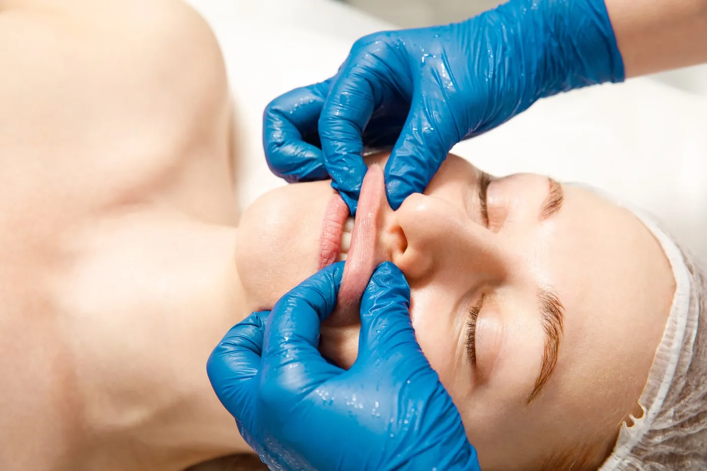 Close-up of a hands-on face lifting massage technique performed at SI Glam Glow in Staten Island