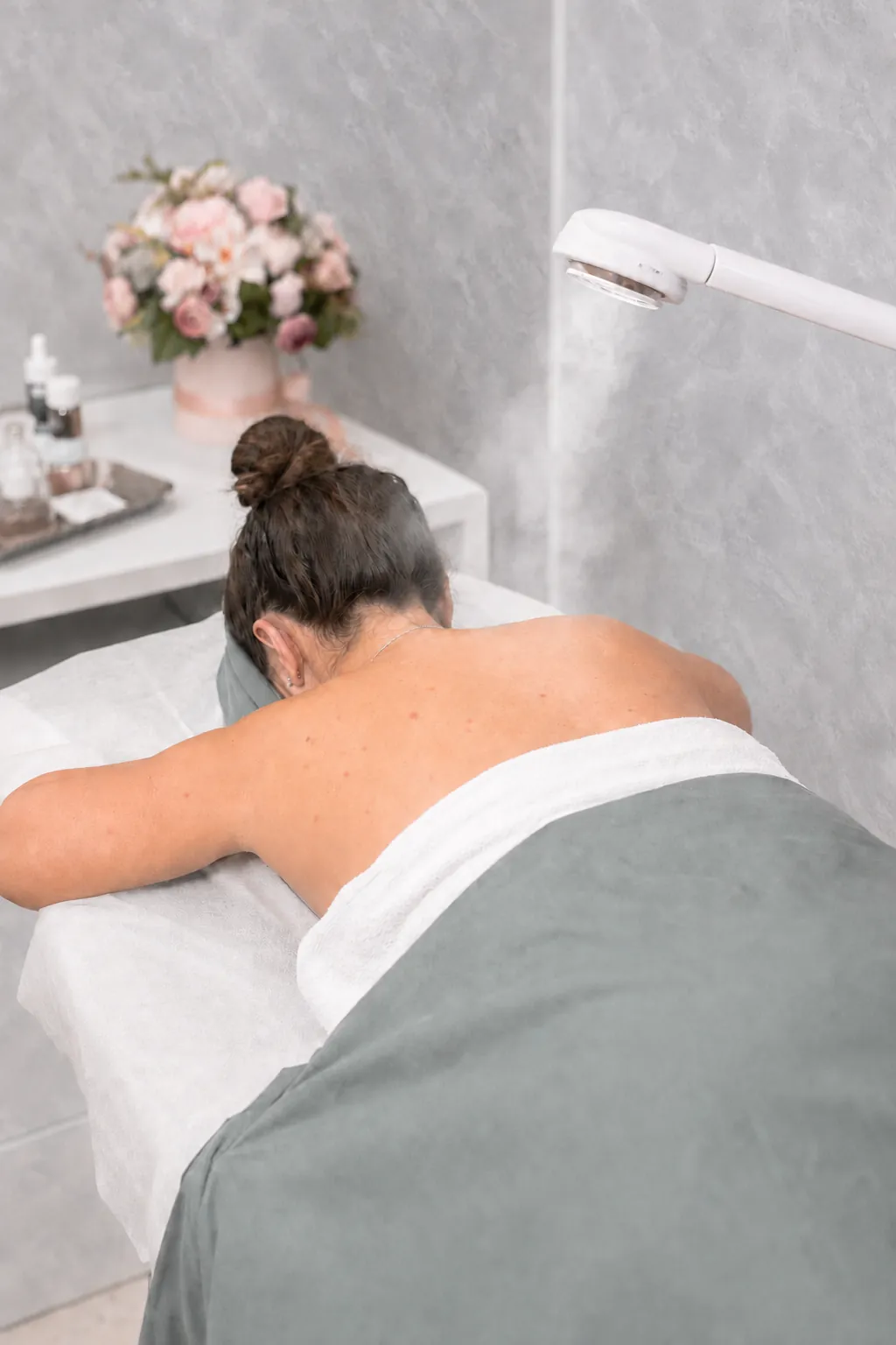 Warm steam application during a Back Facial at SI Glam Glow in Staten Island