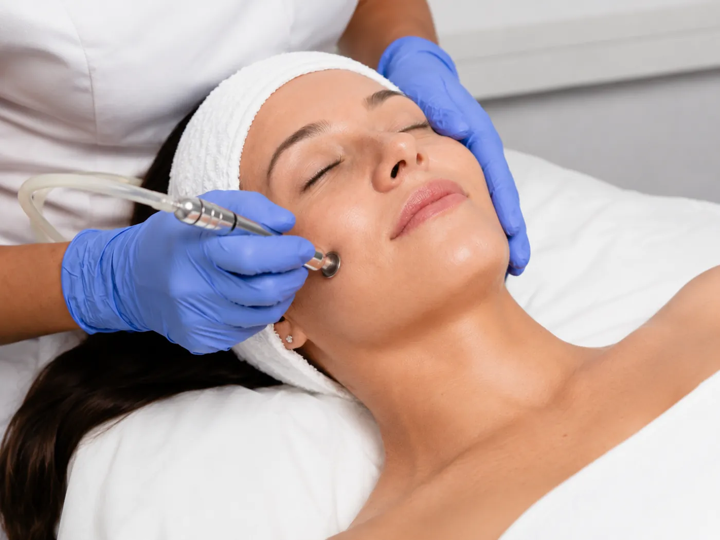 Close-up of a microdermabrasion treatment in progress at SI Glam Glow in Staten Island
